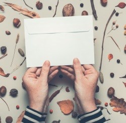 Woman holding an envelope