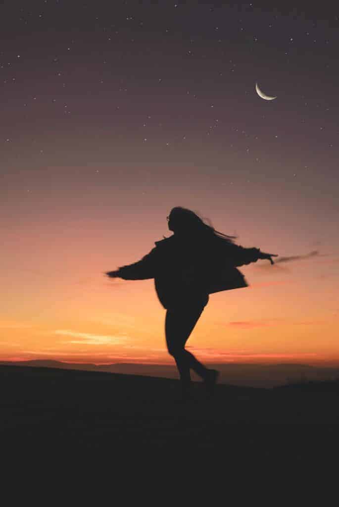 Woman dancing with the moon